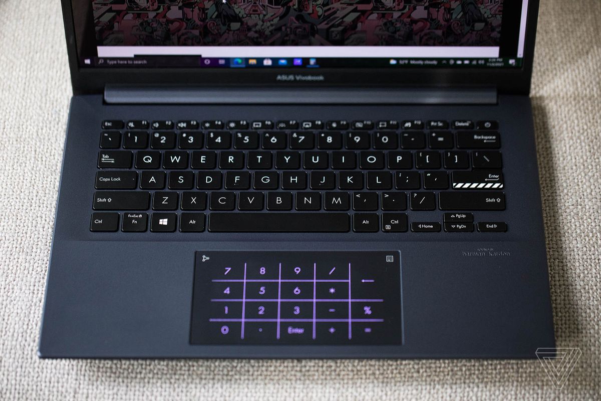 The Asus Vivobook Pro 14 keyboard with the numpad illuminated seen from above.