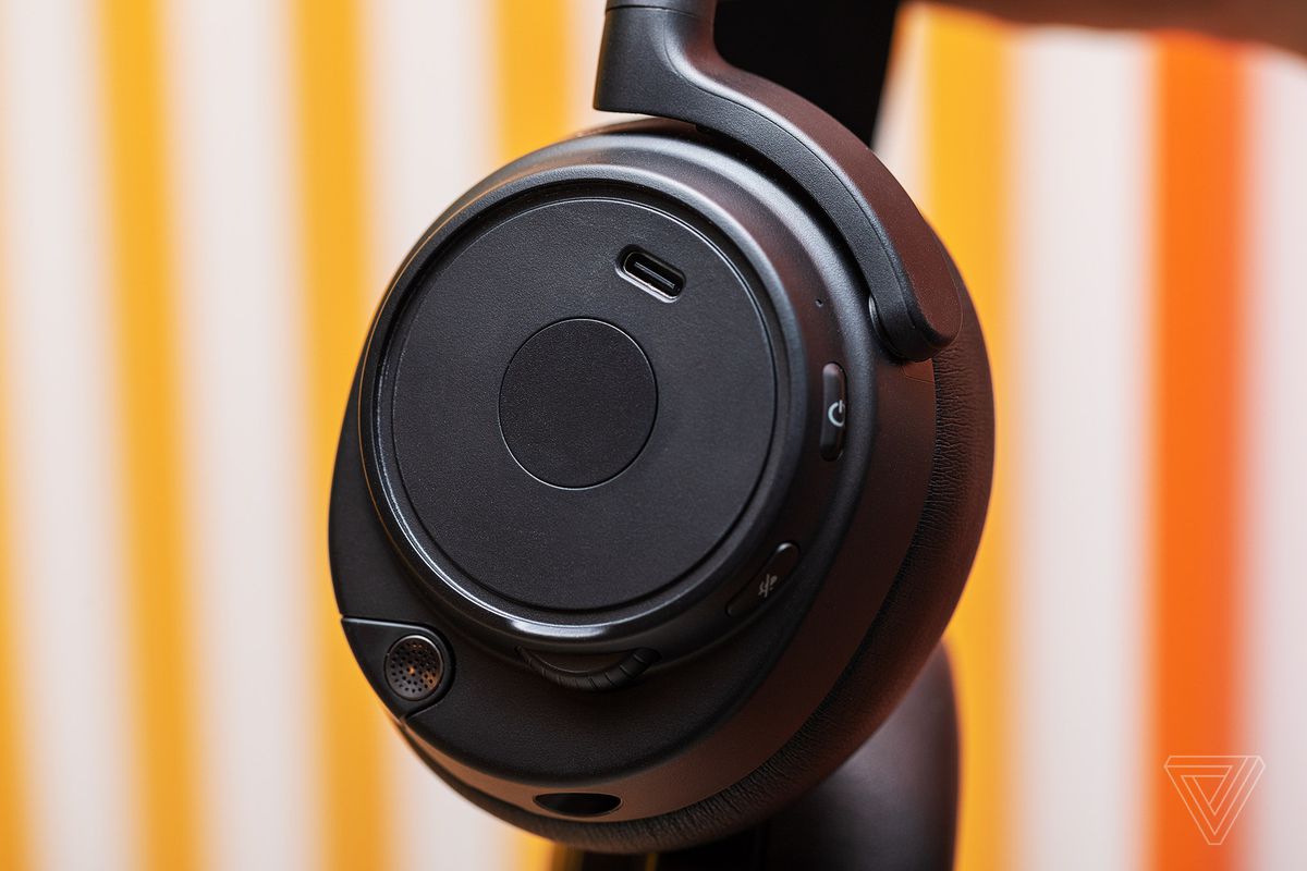 The USB-C charge port is hidden beneath the left earcup cover disc.