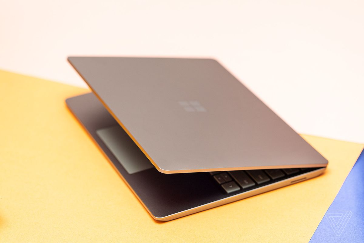 A three quarter view of the Microsoft Surface Laptop Go 2 with its lid about 30 degrees open.