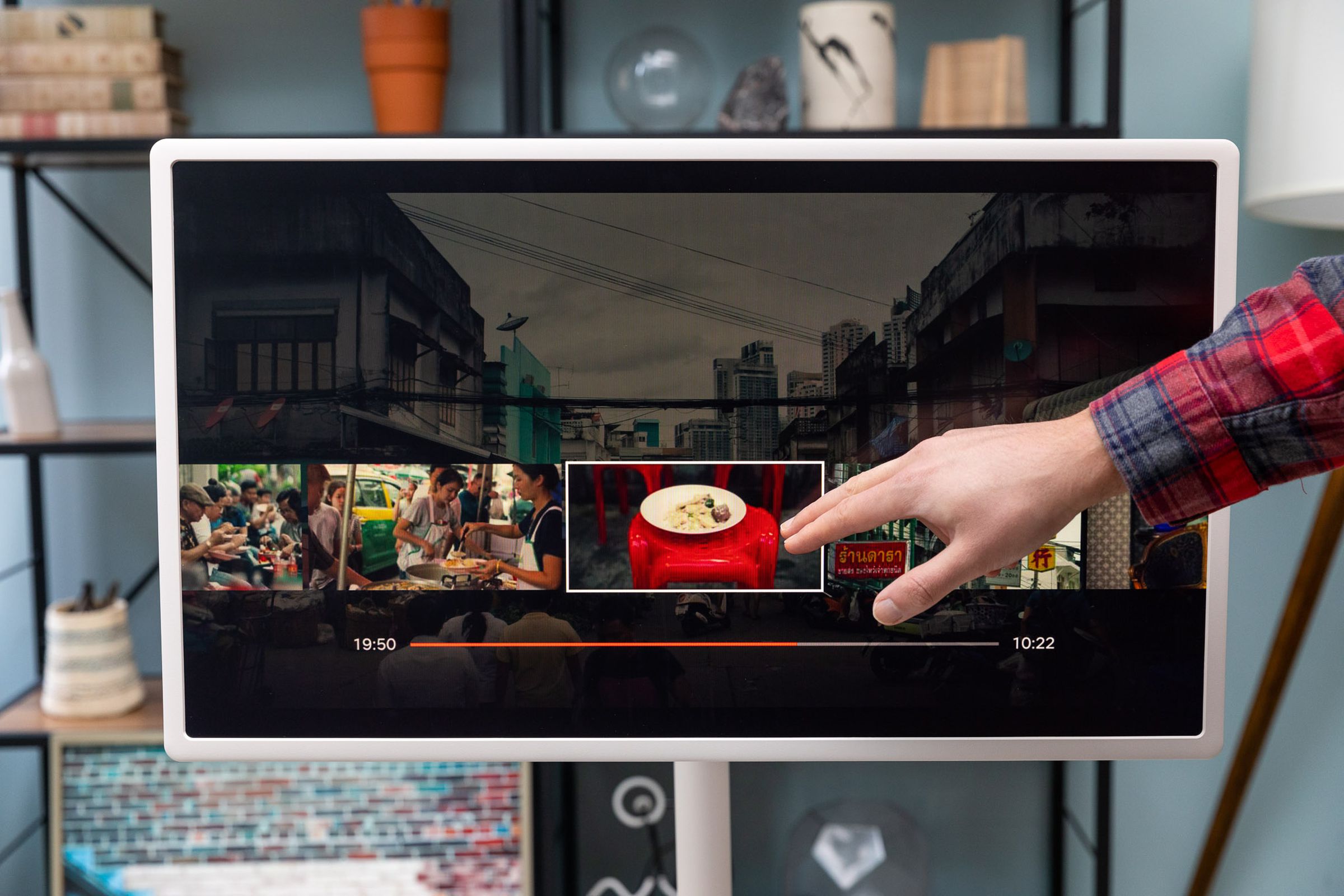 LG’s StanbyME TV showing Netflix, with the author using his fingers to navigate through an episode of a cooking show.